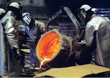 Norfolk, Virginia, USA --- Shipyard Workers Pouring Aluminum into Cast --- Image by   Karen Kasmauski Corbis