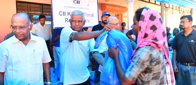 Distribution of relief material to victims of Kerala Floods